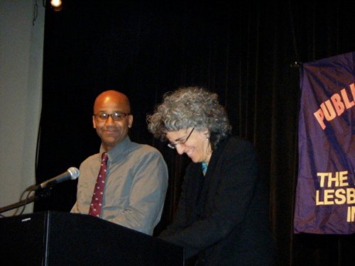 Last year's winner, Kai Wright and Andrea Weiss, share a laugh on stage before naming the winners of the nonfiction awards. 